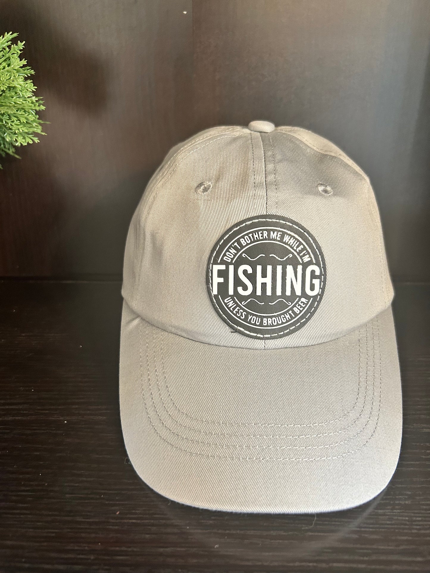 "Don't bother me while I'm FISHING unless you brought a beer" hat.