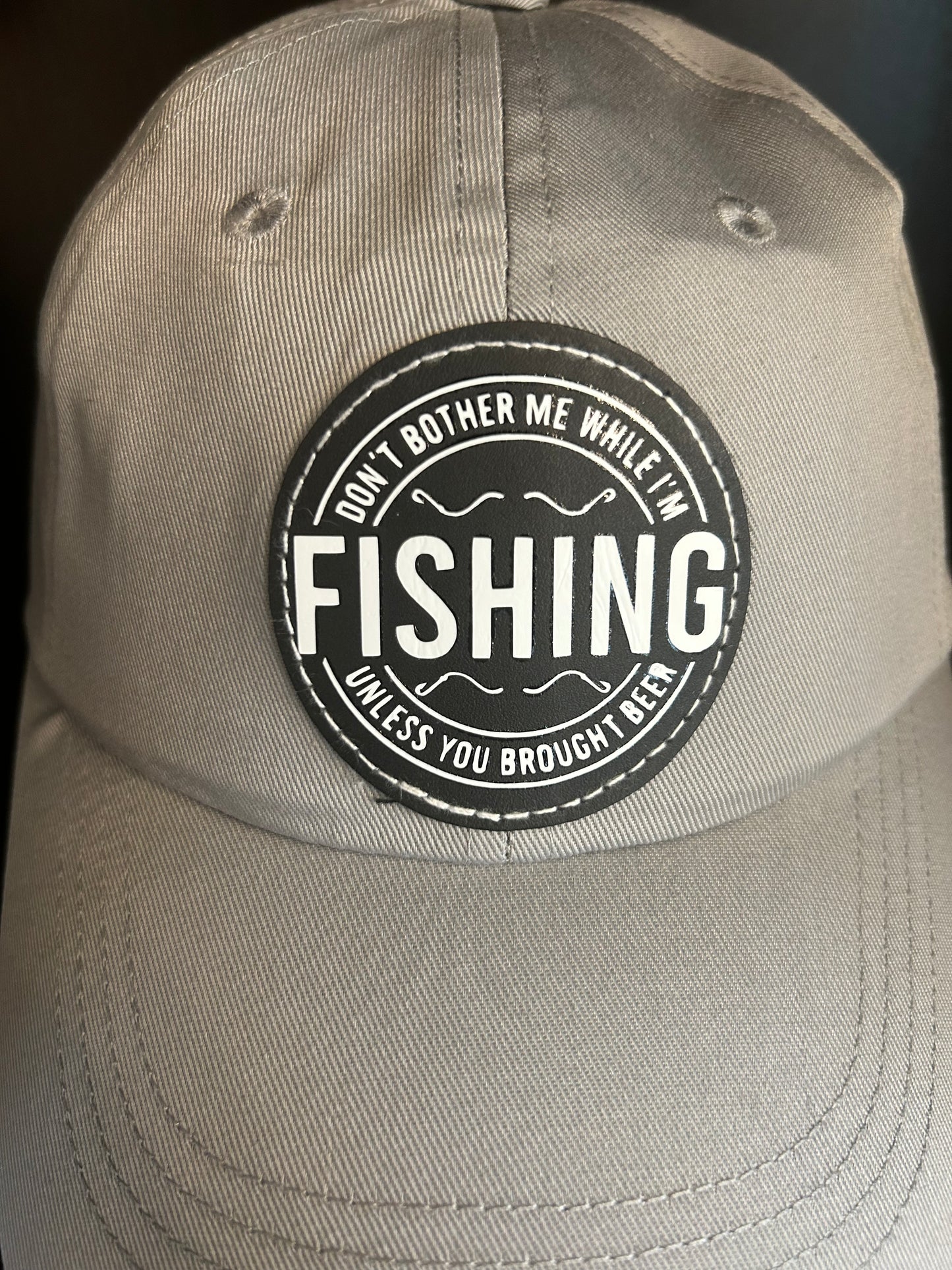 "Don't bother me while I'm FISHING unless you brought a beer" hat.