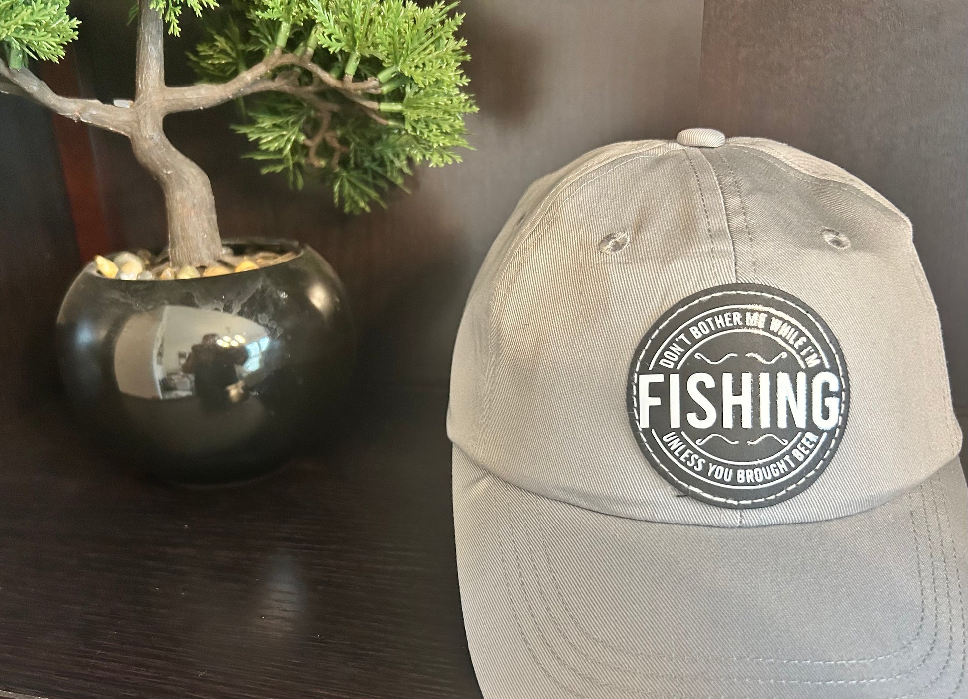 "Don't bother me while I'm FISHING unless you brought a beer" hat.