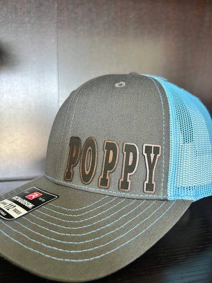 “D A D" custom leather patch on Trucker Hat Charcoal/Columbia Blue